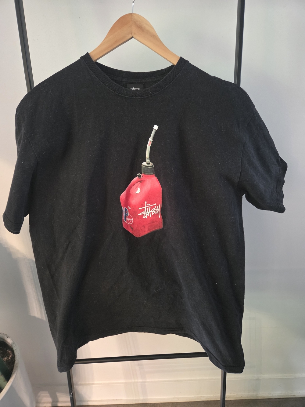 Stussy Black Tee with Red Gas Can Graphic